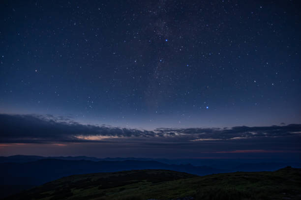 istock Stars in the predawn sky and fog 1175340041