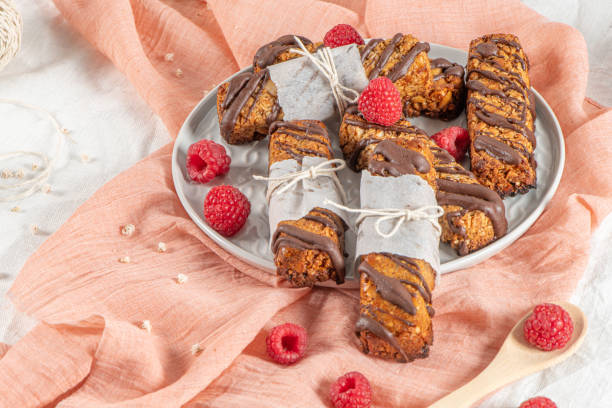 istock Cereal bars with raspberries on kitchen counter top. 1175353656