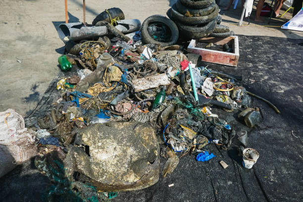 istock Garbage on the beach in the big city. Dirty sea. Environmental pollution. Ecological problem. 1175356718