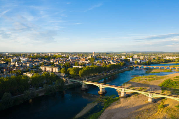 Wide view of Nevers in the Nièvre in Burgundy with the Loire and the railway bridge in the foreground stock photo