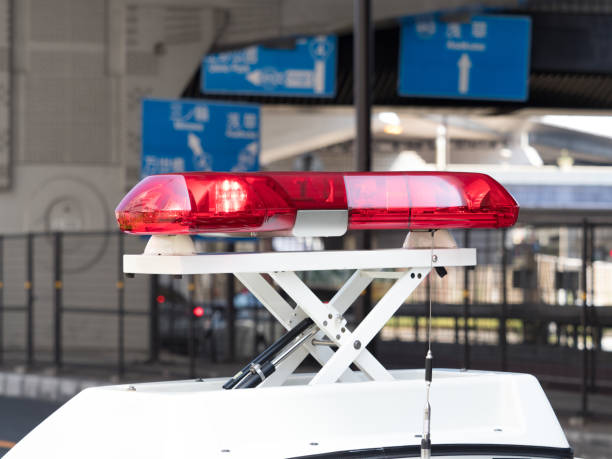 istock Police car red rotating light 1175374157