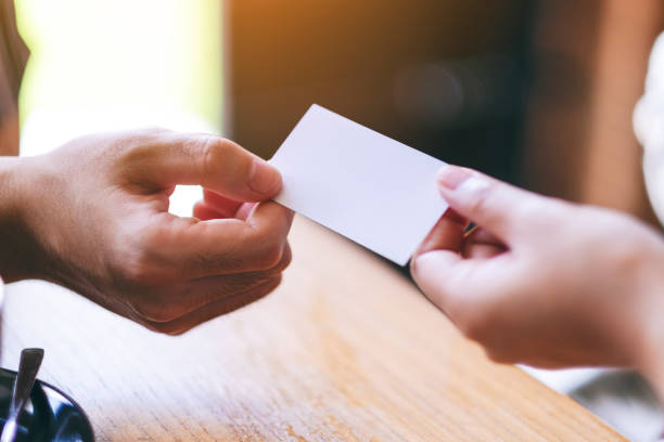 istock businessman holding and exchanging empty business card 1175381107