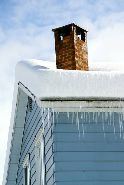istock Snow Covered Rooftop with Chimney and Icicles 117538249