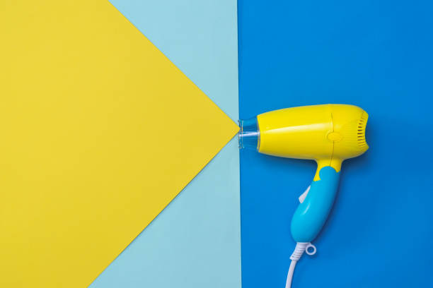 istock Hair dryer with white wire on colorful background. 1175382553