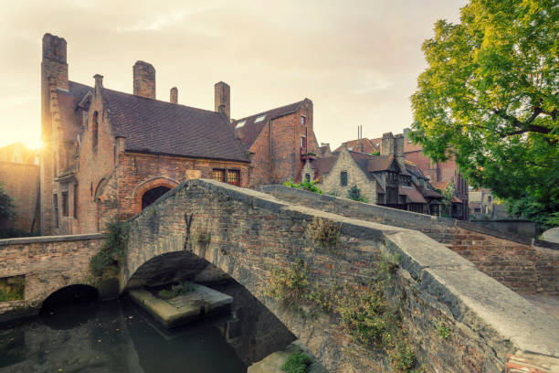 The old and picturesque bridge that connects the backyard of the Church of our Lady with the park of the Arentshuis.