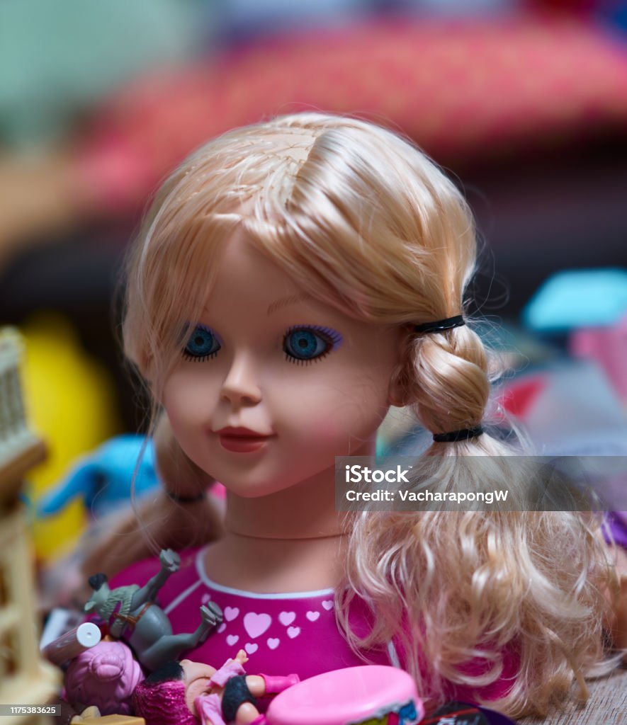 Doll head for kid play make up and comb hair Doll Stock Photo