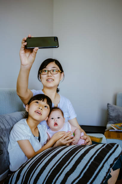 istock Happy Asian family, taking photos. 1175387057