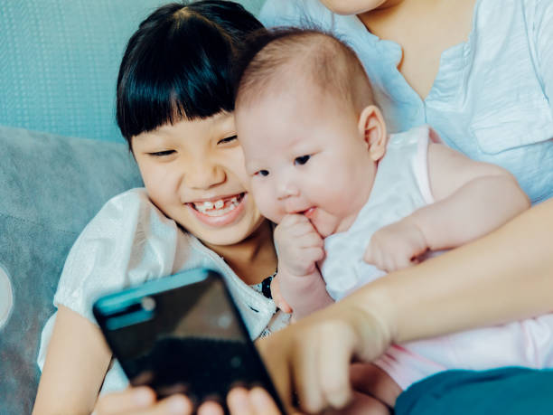istock Happy Asian family, taking photos. 1175387063