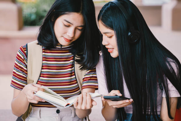 istock Asian university students chating, talking in university campus. 1175393154