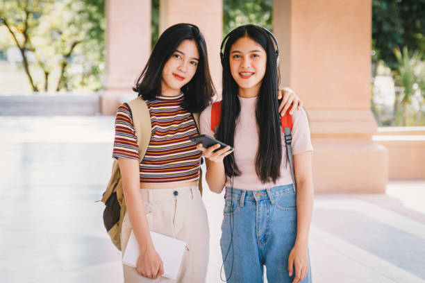istock Asian university students chating, talking in university campus. 1175393161
