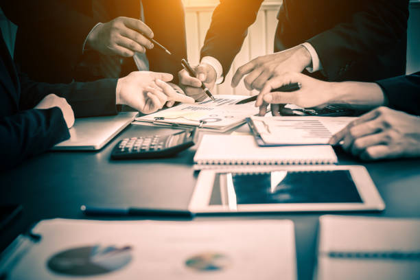 istock Business group or business partners discussing documents and ideas at meeting 1175395481