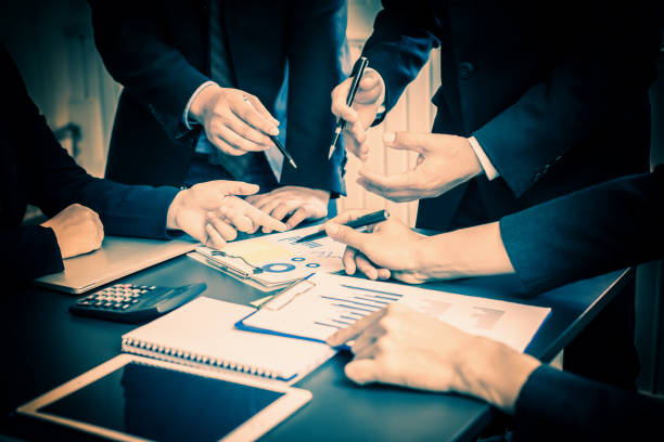 istock Business group or business partners discussing documents and ideas at meeting 1175395498