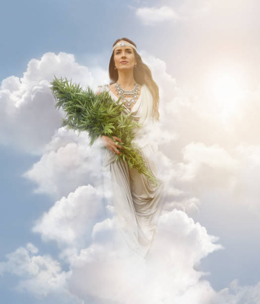 istock Cannabis Goddess holding bundle of cannabis plants 1175399670