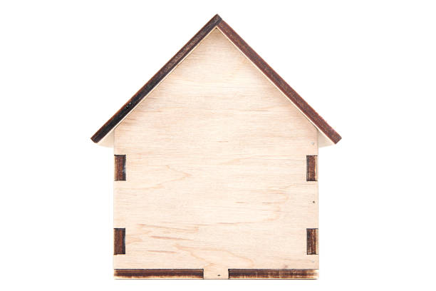 istock Wooden house model isolated on white background 1175404588