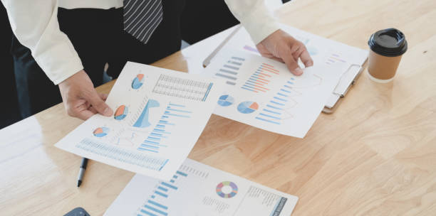 istock Young professional accountant preparing financial reports with charts and graphs 1175404792