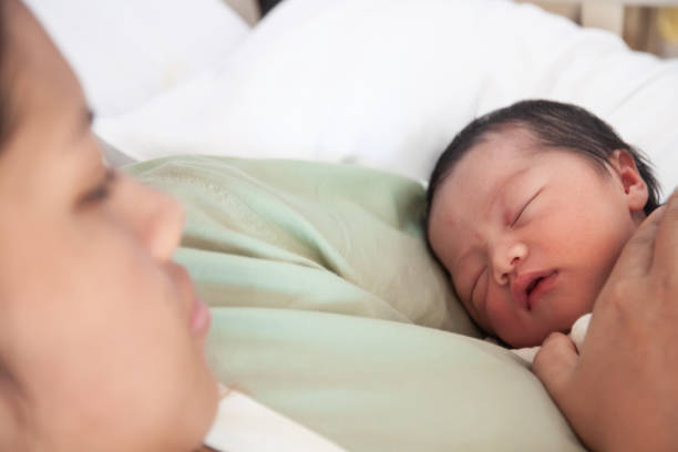 istock Mother and kid in the holding 1175406004