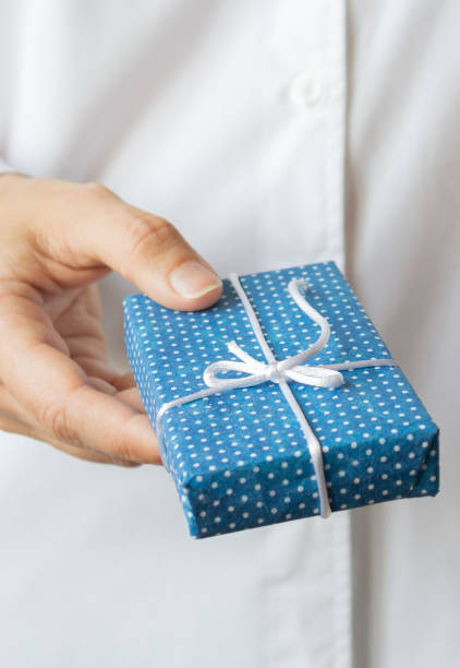 istock Gift box in womans hands. Christmas concept. 1175408318