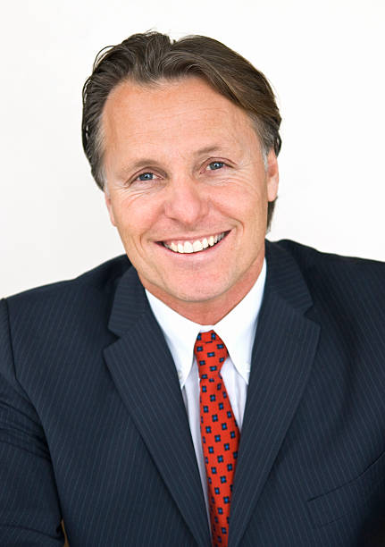 A picture of a man in a suit and tie smiling stock photo