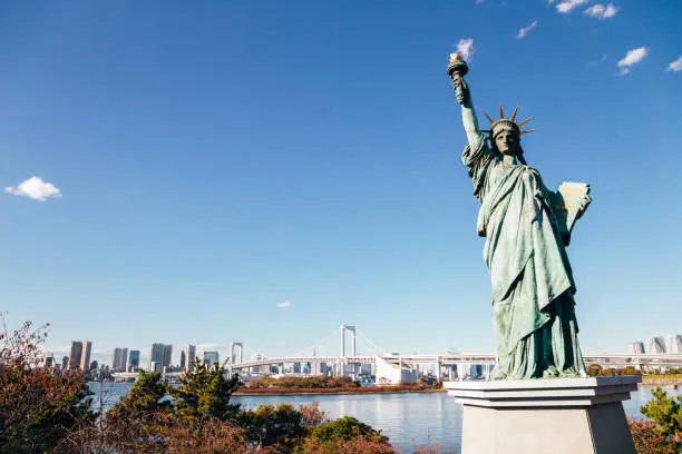 Tokyo bay and Odaiba Rainbow bridge and Statue of Liberty in Japan
