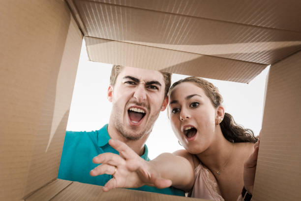 istock Couple opening cardboard box very happy 1175412905