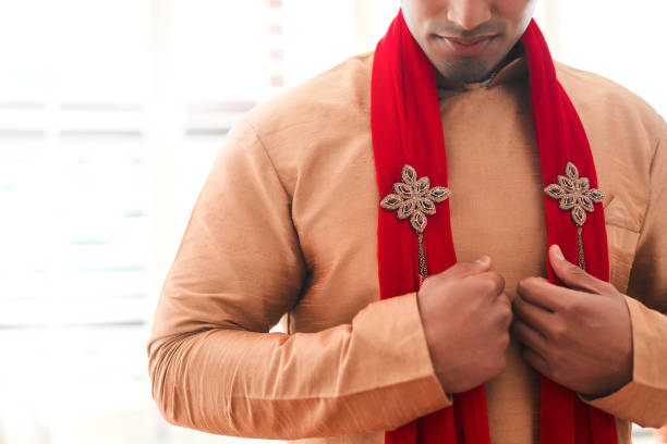 istock Finishing his look off with a striking red shawl 1175414341