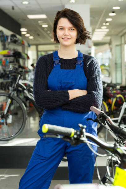 istock Smiling professional woman standing in shop 1175416443