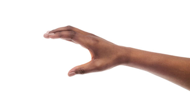 рука афро-женщины достигает чего-то невидимого на белом фоне - isolated hand стоковые фото и изображения