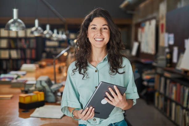 Young creative worker portrait looking at camera. Lifestyle  new business office in Barcelona. young graphic designer stock pictures, royalty-free photos & images