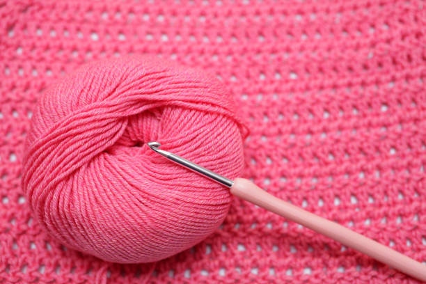 istock Double crochet stitch DC background with ball of yarn 1175421974