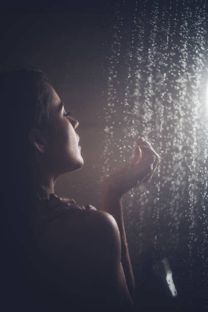 istock Beautiful woman taking a shower. 1175422196
