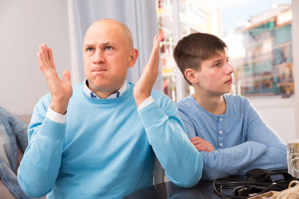 istock Father and son offended at each other 1175422722