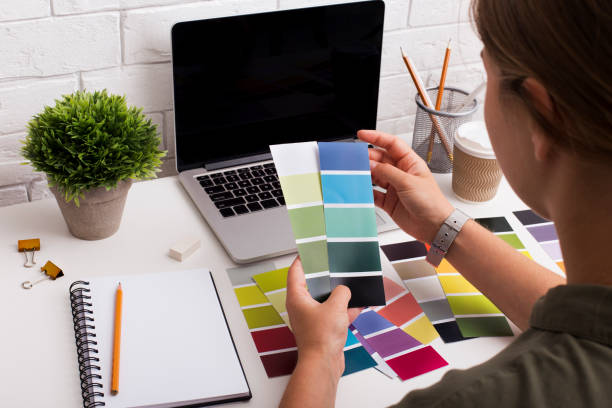 istock Young girl designer picking up colors for clients on workplace 1175423813