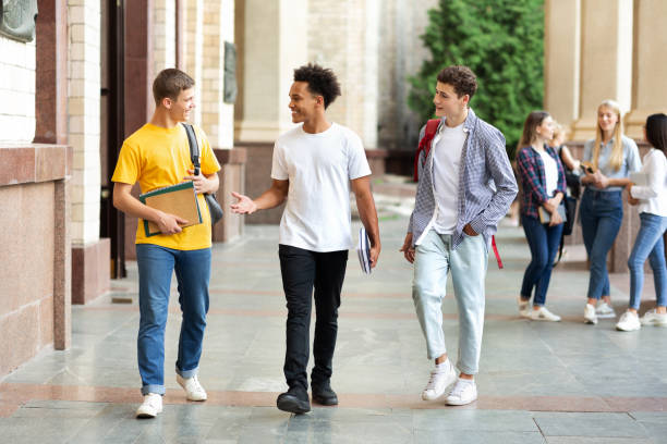 istock College friends walking during break in campus 1175424894