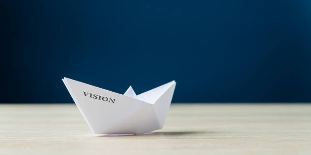 istock Origami boat with the word Vision on it 1175425086