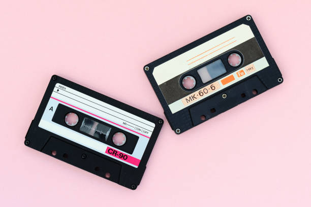 istock Old audio tape cassettes on a pink background. Top view, old technology concept 1175427089