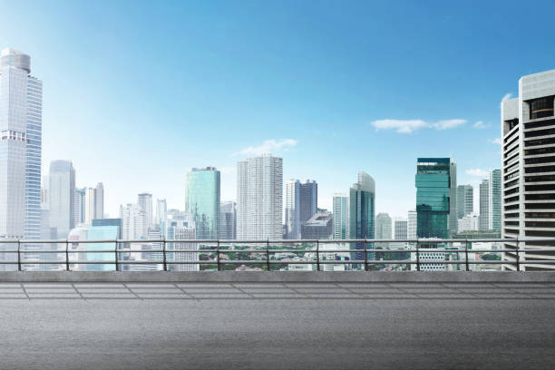 istock Asphalt road with modern building and skyscrapers 1175431038