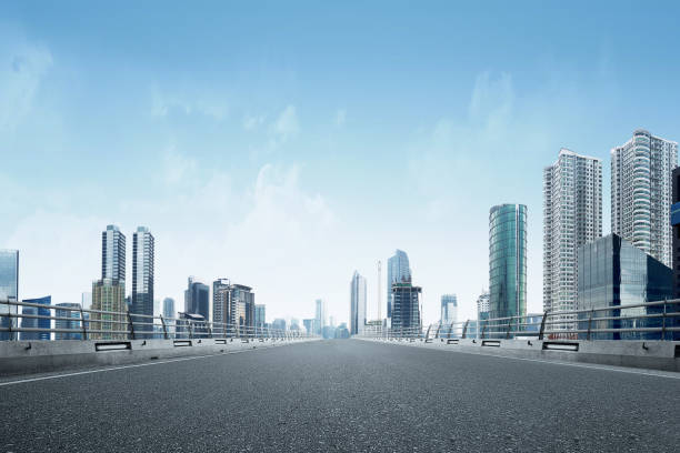 istock Asphalt road with modern building and skyscrapers 1175432404