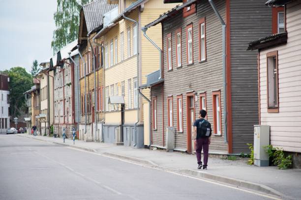 A mid adult man traveling through the Baltic region, exploring his destination on foot.
