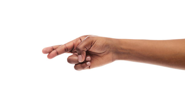 istock Black woman's hand with crossed fingers, isolated on white background 1175433186
