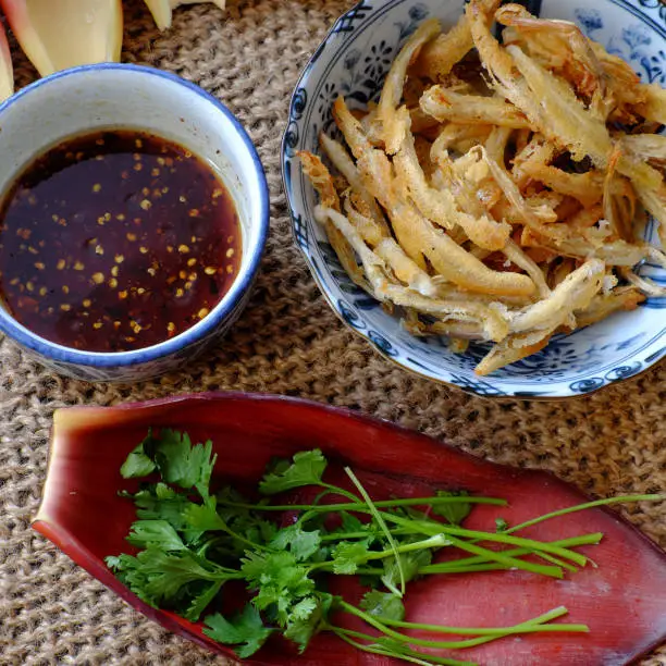 High view of homemade Vietnamese food for vegetarian, banana flower vegan fish, a delicious eating from young bananas deep fry with crispy flour and soy sauce