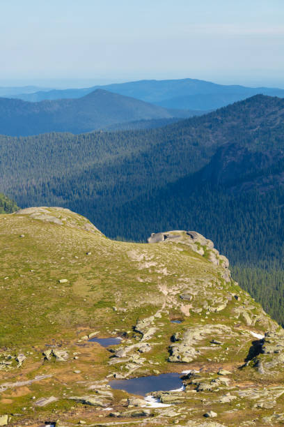 istock Very beautiful mountain scenery. Panoramic view from a mountain pass in Siberia 1175440400