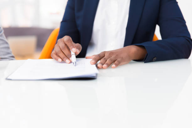 istock Businesswoman studying contract text 1175442216