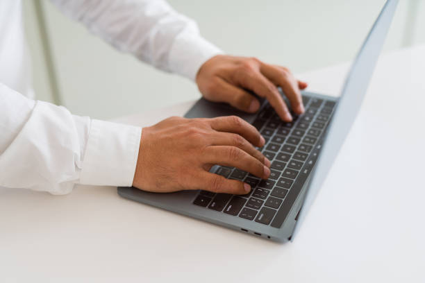 istock Close up of business man working using computer laptop 1175442321