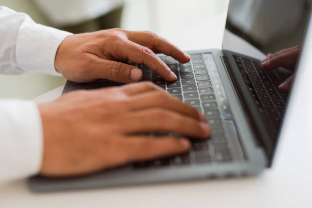 istock Close up of business man working using computer laptop 1175442341