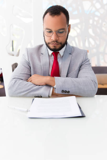 istock Confident business leader studying contract 1175442546