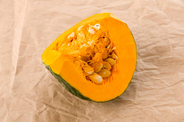 istock 1/4 sliced pumpkin(kabocha squash) on kraft Paper 1175444869