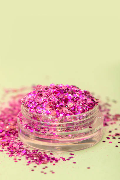 istock Pink shimmer and glitter in small plastic box. 1175446482