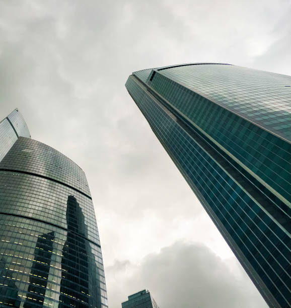 Moscow business center, view from the bottom up. Futuristic building made of metal and glass. Skyscrapers with glass windows. stock photo