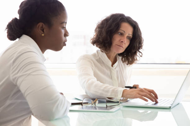 istock Businesswomen working on project together 1175448028
