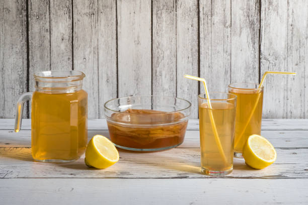 istock Kombucha fungus. Organic fermented tea drink with lemon. 1175448982